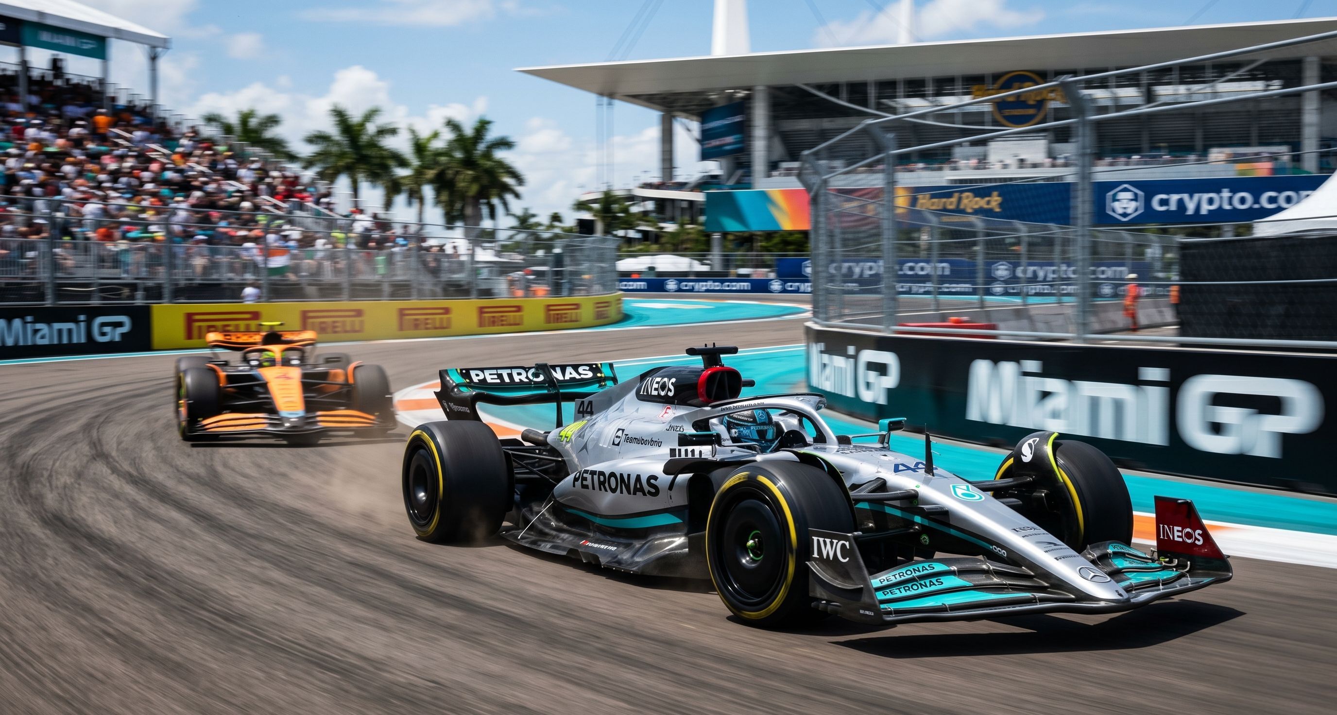 Mercedes #44 leads a McLaren through a corner at the Miami Grand Prix